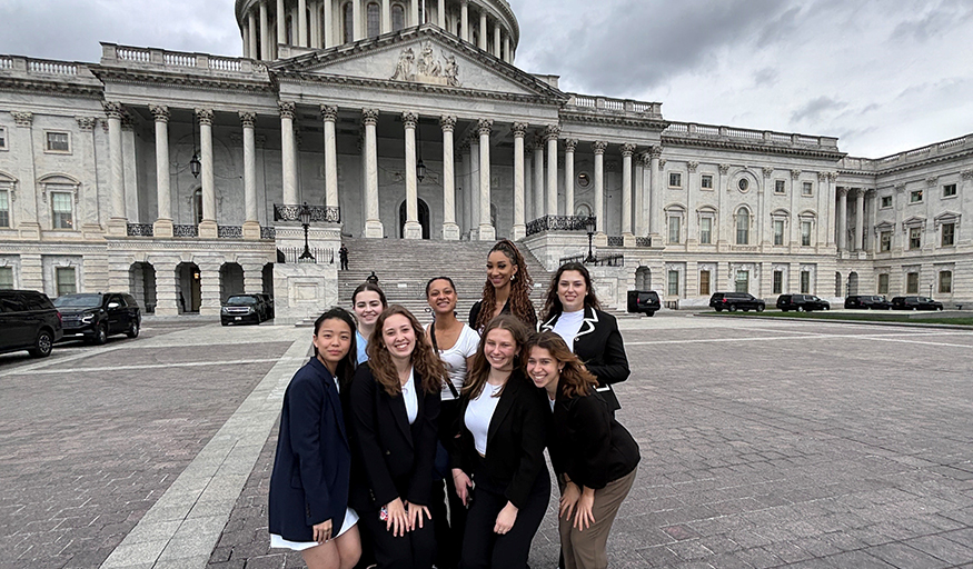 Group of 8 UW students in front of the US Capitol Building.