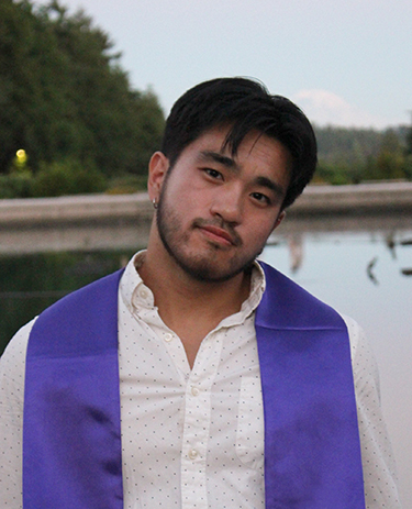 Andre Ye, seated by UW's Drumheller Fountain