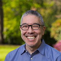 Kevin Mihata smiling at camera