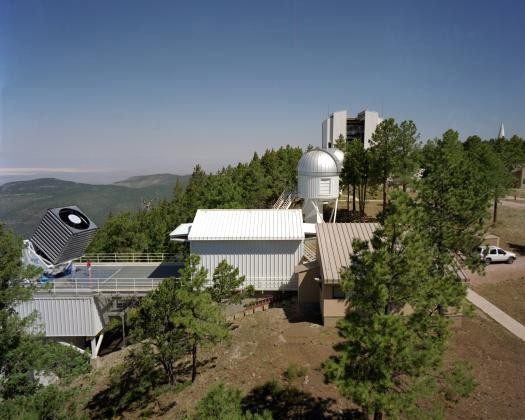 Apache Point Observatory, with 2.5-m telescope of the Sloan Digital Sky Survey at lower left and 3.5-m research telescope at upper right. 