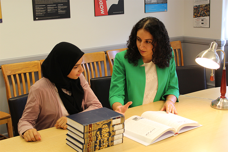 Dr. Arbella Bet-Shlimon (right), winner of the 2017 UW Distinguished Teaching Award, working with a History undergraduate student.