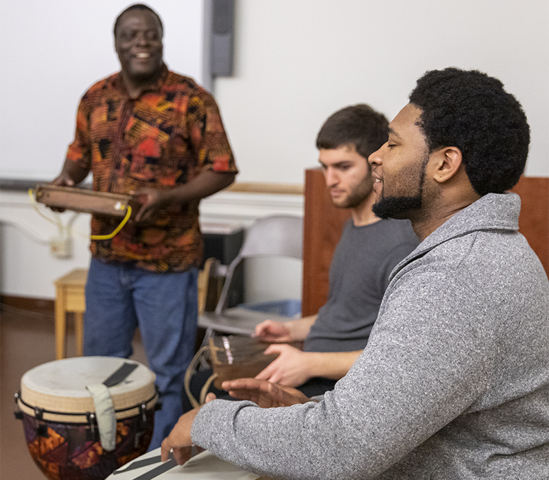 UW School of Music ethnomusicology class with students playing instruments.