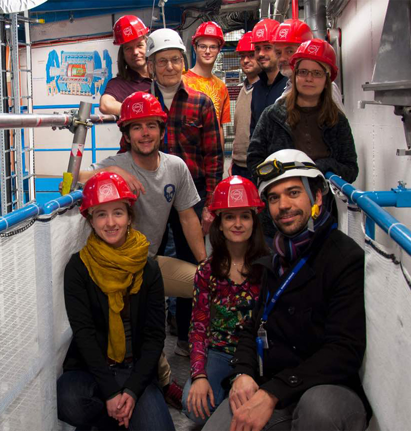 A group of students participating in a UW Physics field trip wearing hardhats.