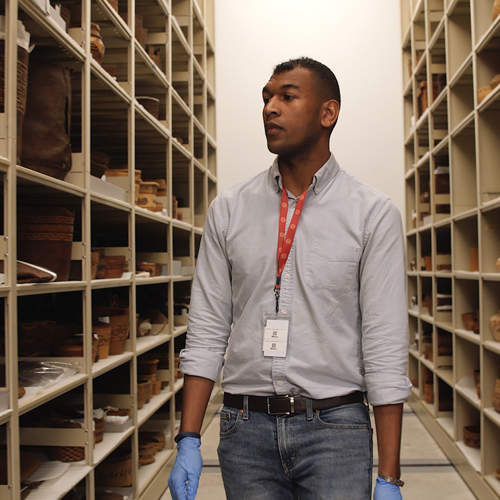 Student in a collection storage area at the Burke Museum. 