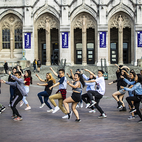 Group of students performing a dance on UW's Red Square.