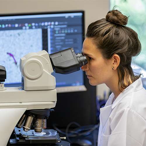 Graduate Student with Microscope