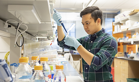 A student researcher in a lab at the UW