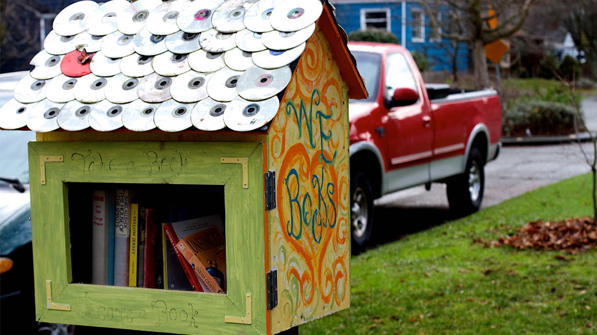 Little free library on sidewalk of Seattle neighborhood
