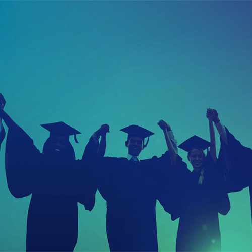 Silhouettes of people in graduation caps and gowns with their arms up. 