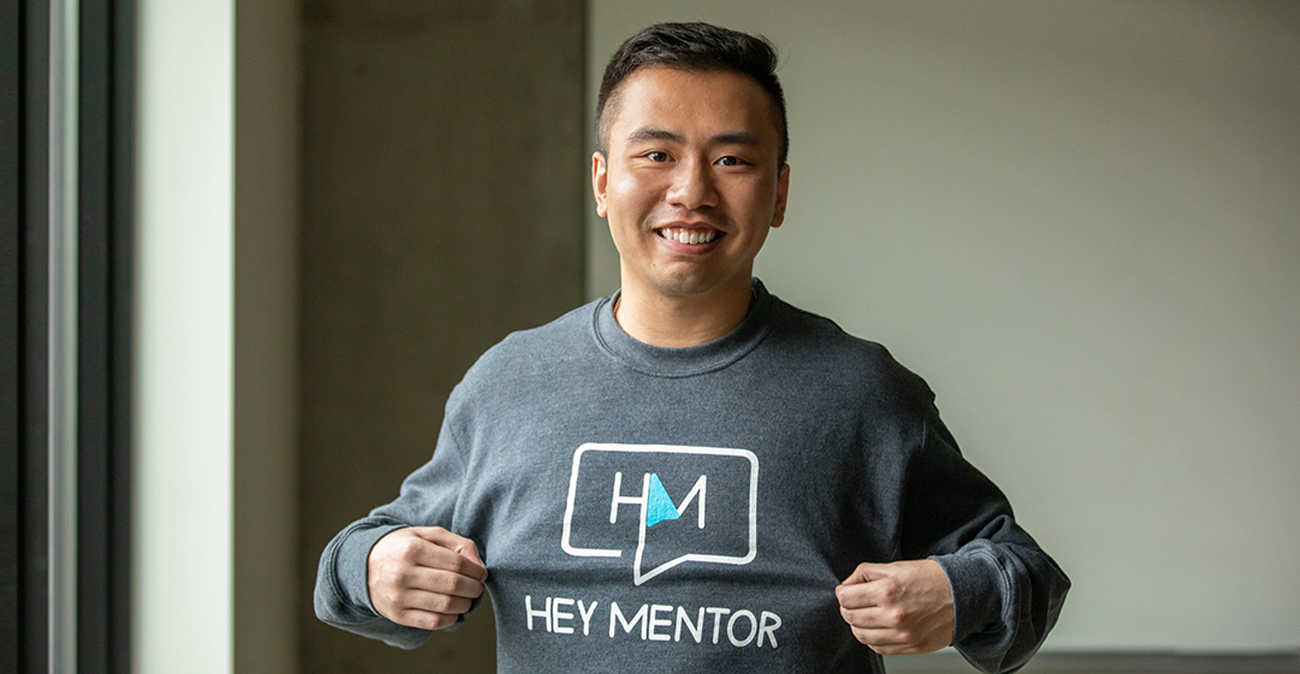 Kevin Truong wearing a "Hey Mentor" t-shirt