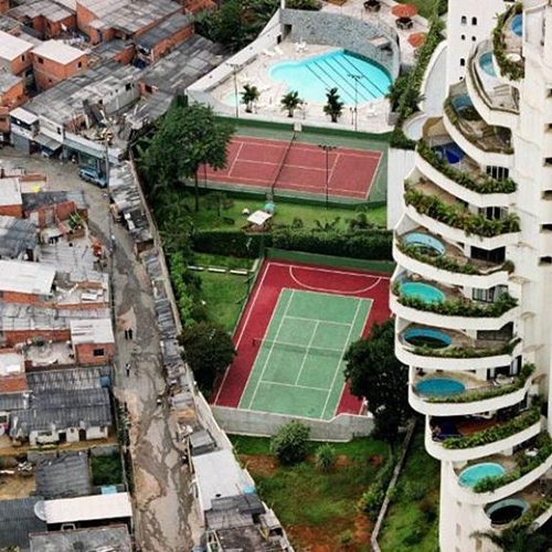 aerial view of affluent and non-affluent neighborhoods side by side