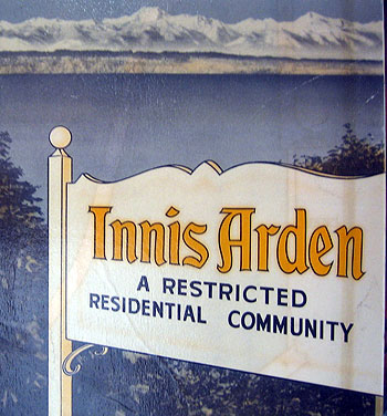 A neighborhood sign for Innis Arden, describing it as "a restricted residential community."