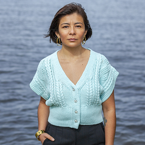 Iris Viveros Avendano standing in front of water.