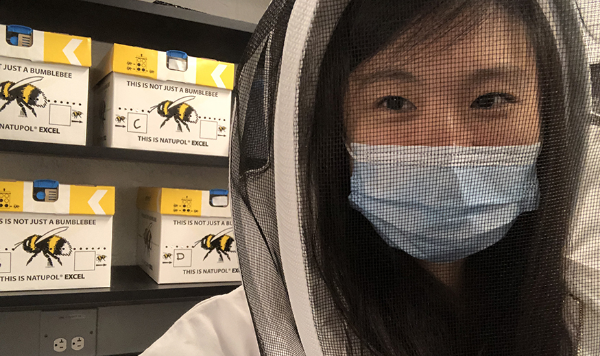 Z Yan Wang in beekeeping gear.