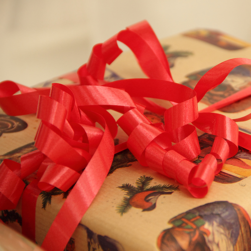 wrapped present with a red bow
