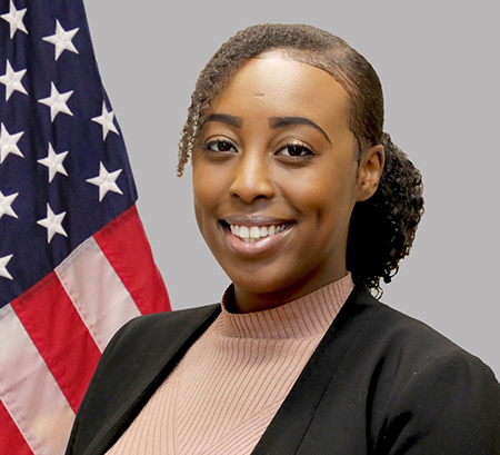 Annah Mwendar-Chaba official portrait in front of the American flag.