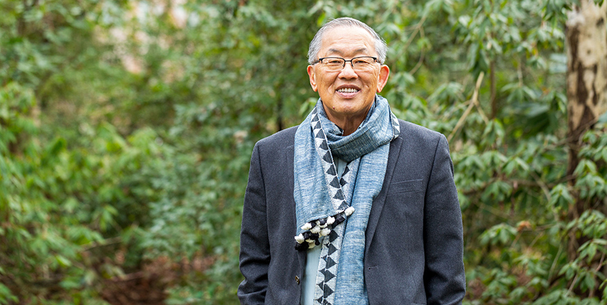 Portrait photo of Anand Yang on the UW campus.