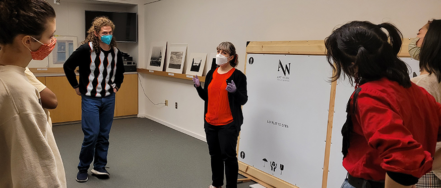 Students meet with curator Ann Poulson at the Henry