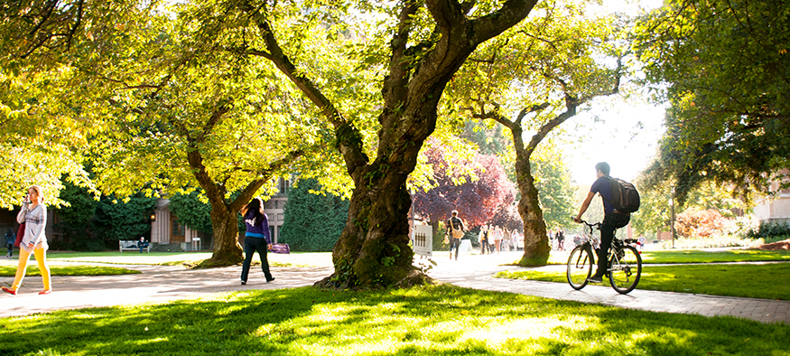 Students crossing the UW quad on a sunny autumn day. 
