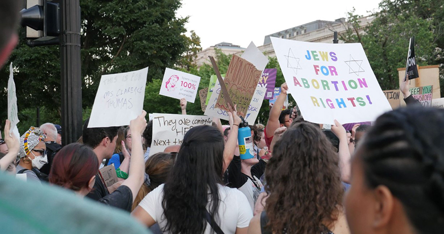 Protesters in Washington, DC, holding signs in support of abortion rights. 
