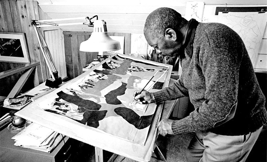 Jacob Lawrence working in his studio.