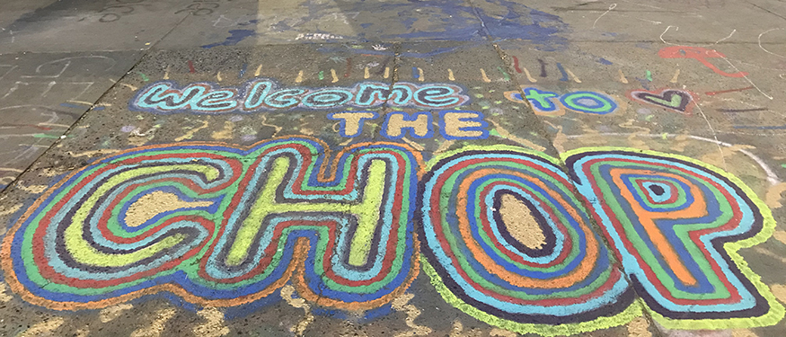 Welcome to the CHOP message drawn in colorful chalk on the street