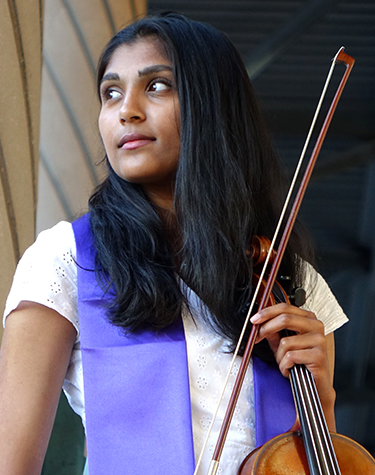 Meghna Shankar holding a viola and bow