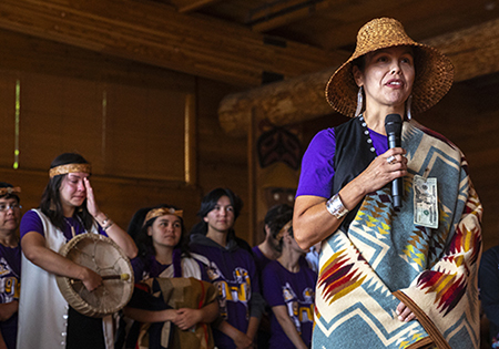 Nicole Kuhn speaking at the ceremony for the gifting ot the Willapa Spirit Honor Canoe