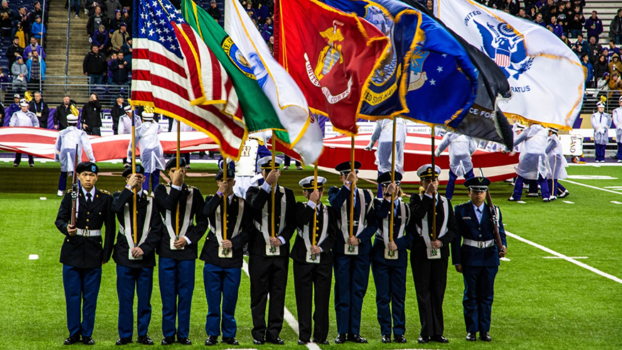 Color guard in uniform, with flags