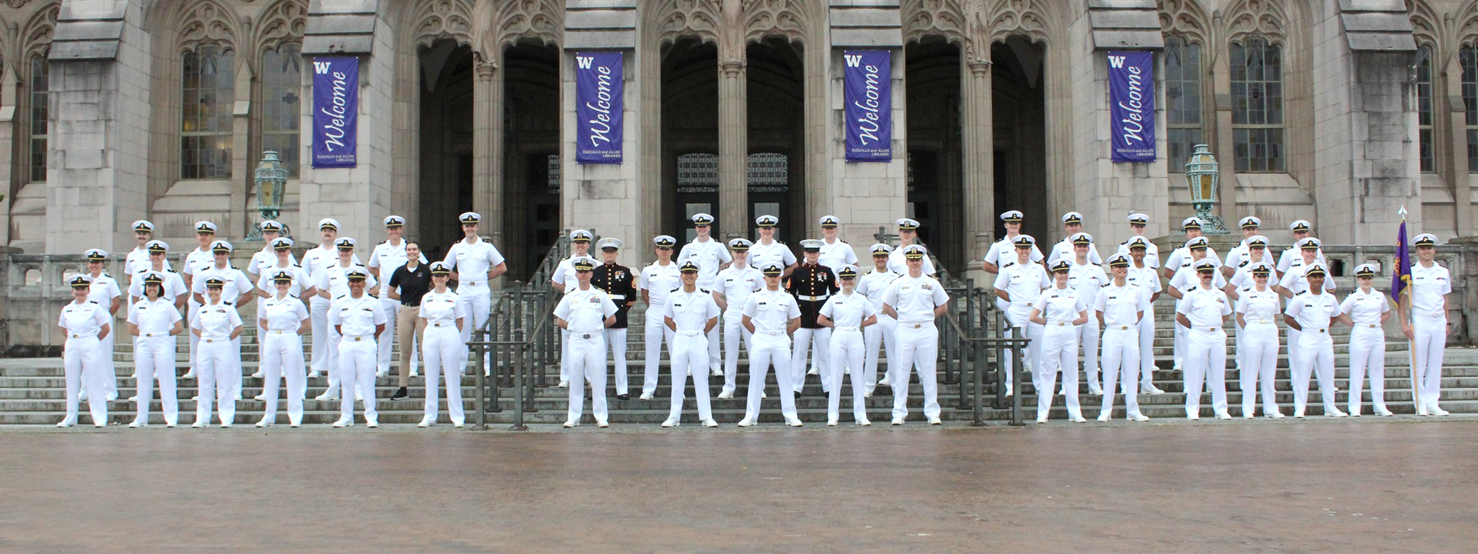 Navy ROTC students in Navy whites outside Suzzallo Library