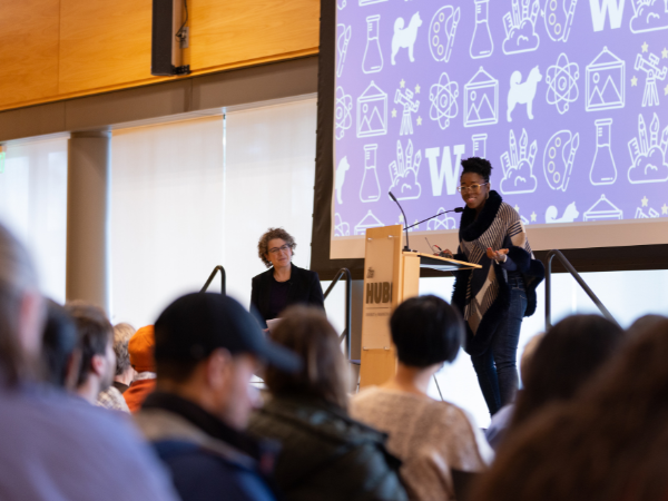 Dr. Emily M. Bender, UW Linguistics Professor, and Dr. Joy Buolamwini, author of Unmasking AI: My Mission to Protect What is Human in a World of Machines speaking to the audience at the College of Arts & Sciences' Big Read