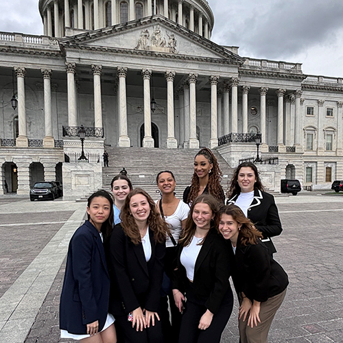 Group of 8 UW students in front of the US Capitol Building.