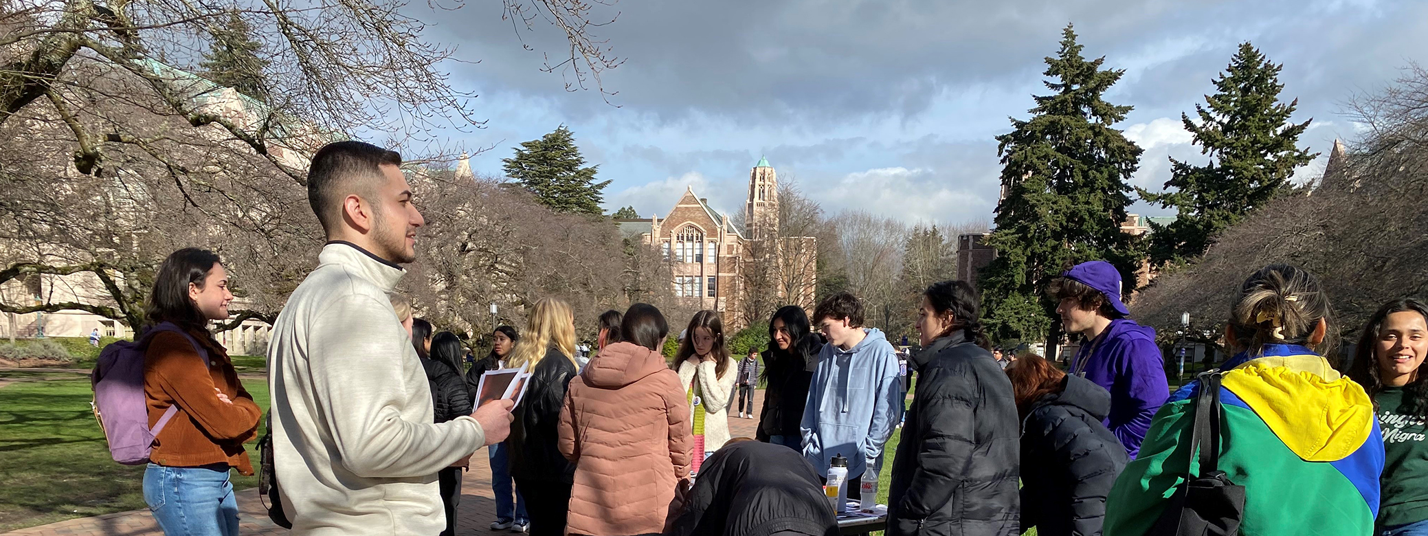 Students handing out flyers on the UW campus to advocate for immigrant rights.