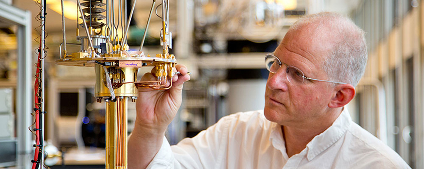 Quantum researcher Charlie Marcus adjusting equipment in the lab. 