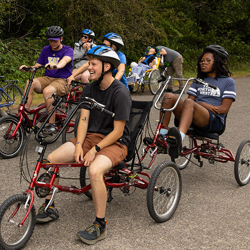 People on adaptive bicycles in Magnuson Park.