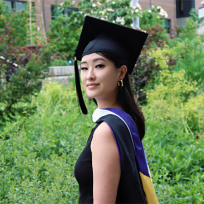 Julie Feng in graduation cap and sash