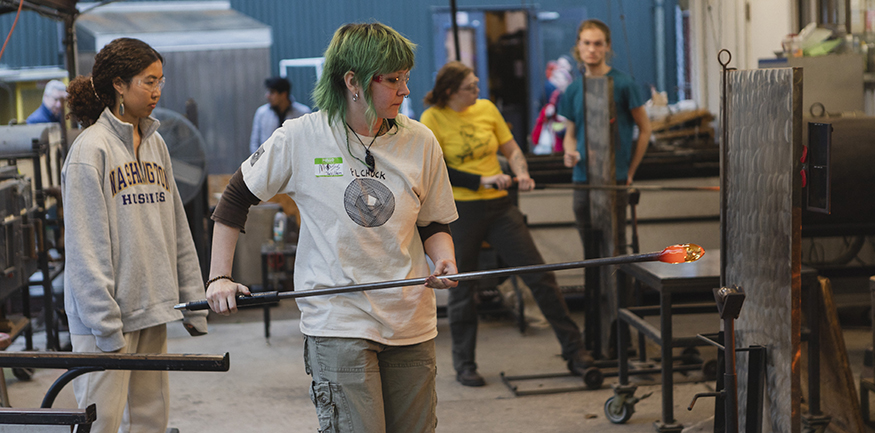 Students working in UW glassblowing studio. 