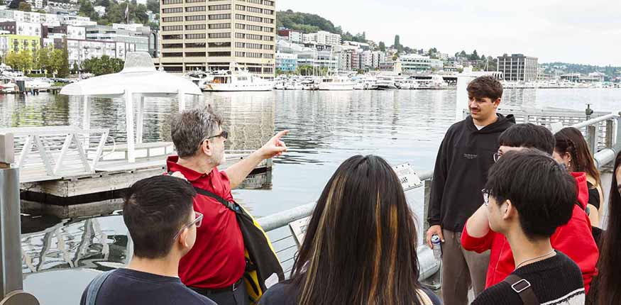 A College Edge class looking out at Lake Union outside Seattle's Museum of History and Industry