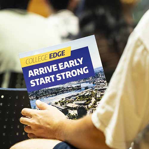 Student holding a College Edge brochure, with the message "Arrive Early, Start Strong" visible on the front.