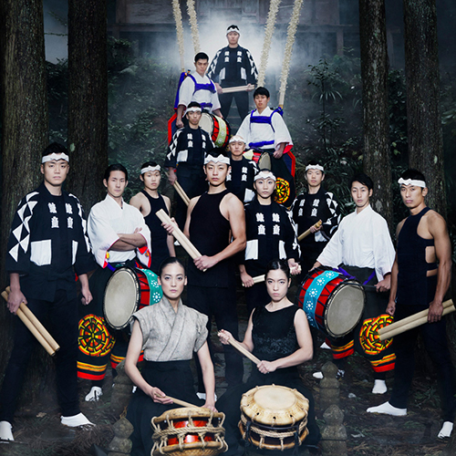 Large group of dancers from the group Kodo, standing with their drums.