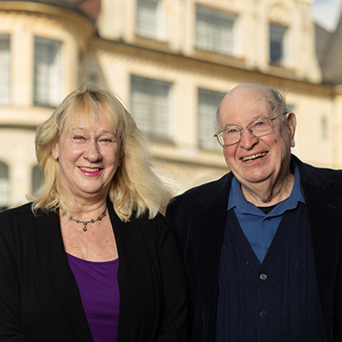 Laura Matz and Larry Bliquez with Denny Hall in the background