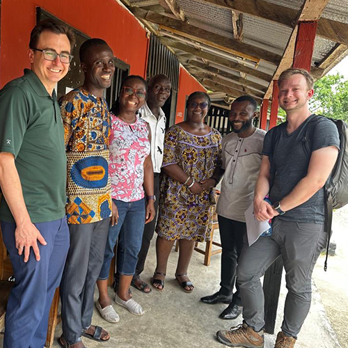 Erik Andersen and Jason Kerwin with four people -- schoolteachers and others -- in Ghana.