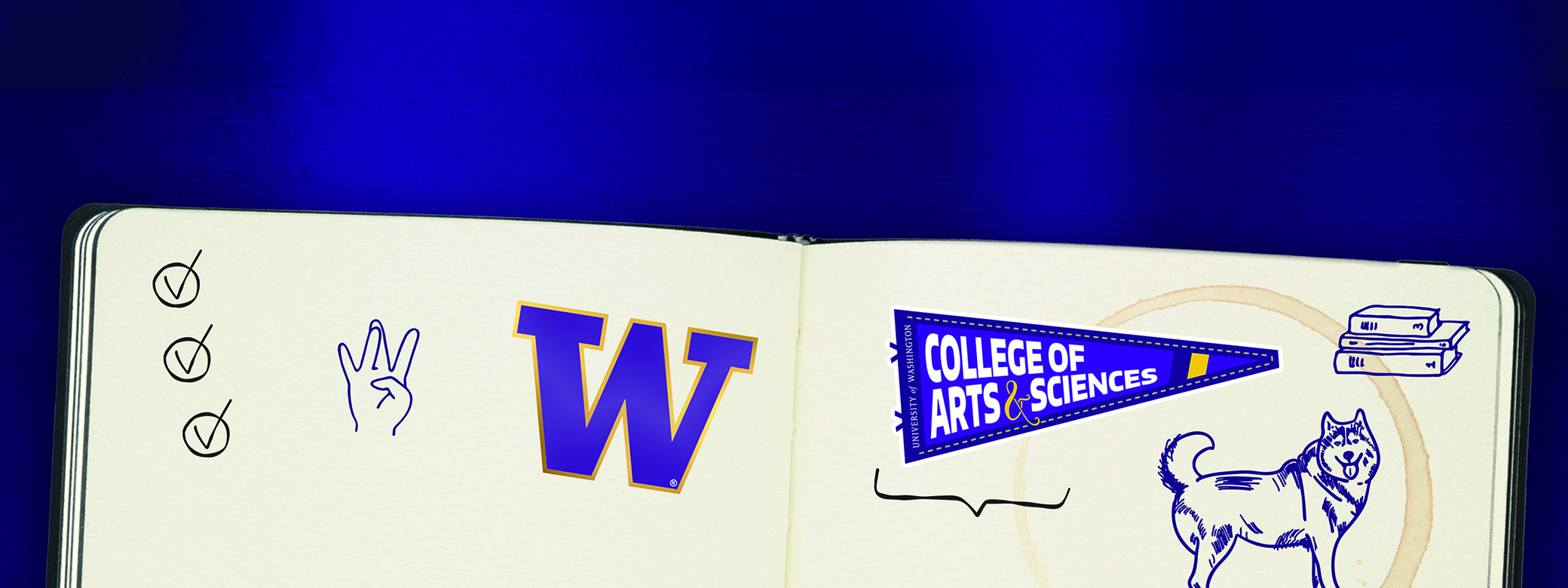 Notebook with UW stickers and doodle drawings.