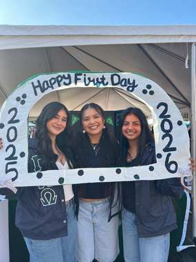 Anna Frank and two friends holding up a sign that reads "Happy First Day, 2025-2026"