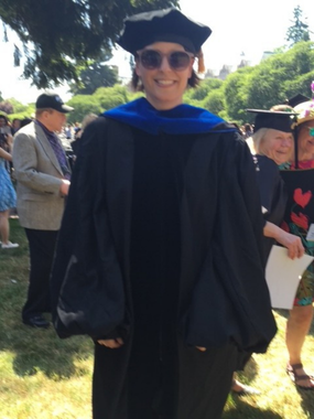 Throwback college-era photo of Communication Professor and Chair Christine Harold in cap and gown