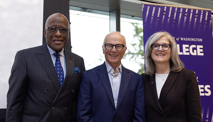 John Simpson standing betweem UW President Robert J. Jones and College of Arts & Sciences dean Dianne Harris.