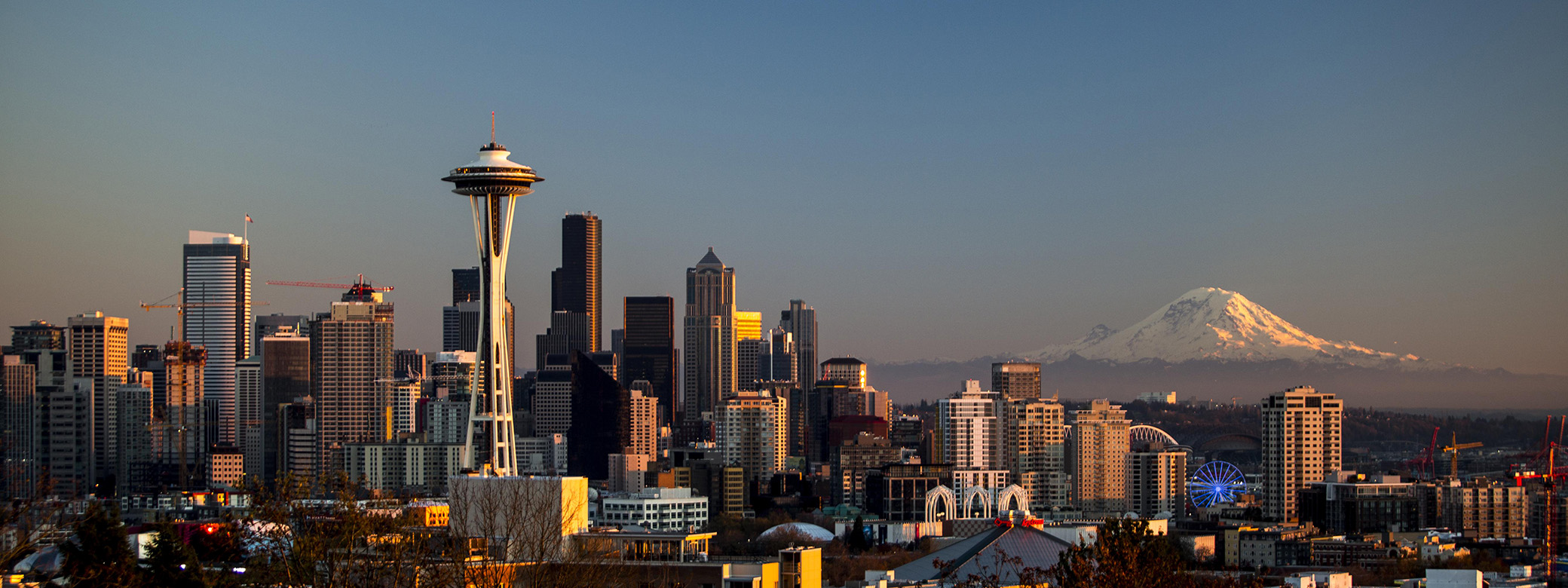 The Seattle skyline, with the Space Needle and Mount Rainier visible. 