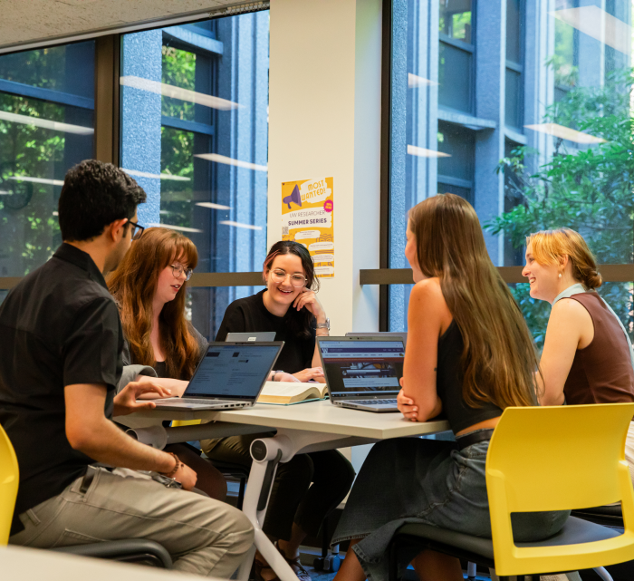 Students sitting around a desk
