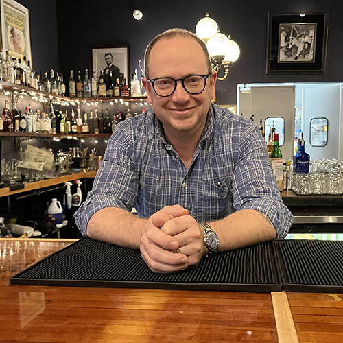 Michael Seguin behind the bar at Mobtown Ballroom.