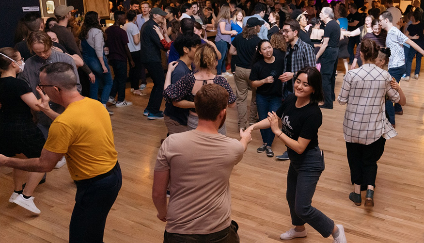 Couples in casual clothes fill the dance floor at Mobtown Ballroom. 